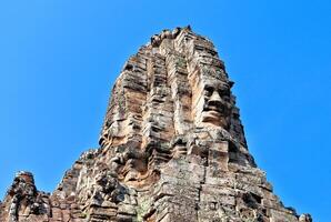 Bayon temple in Cambodia, faces of unknown deities photo