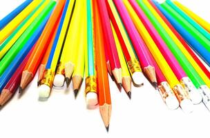 Pencils of different colors on table background photo