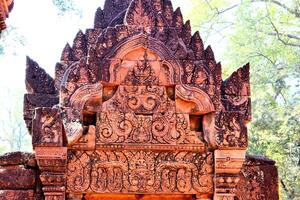 Temples and sculptures in Cambodia in the jungle photo