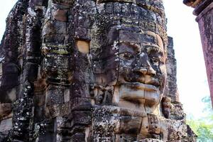 Bayon temple in Cambodia, faces of unknown deities photo