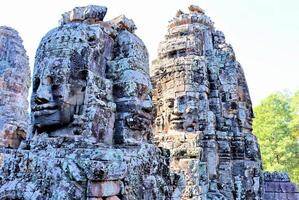 Bayon temple in Cambodia, faces of unknown deities photo