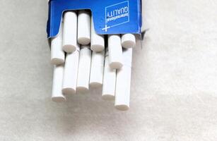 Cigarettes sticking out of the pack, smoking tobacco photo