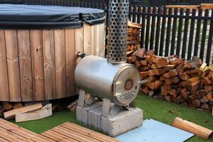 Sauna barrel with a firebox for swimming on the seashore photo