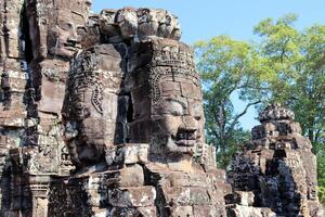 Bayon temple in Cambodia, faces of unknown deities photo