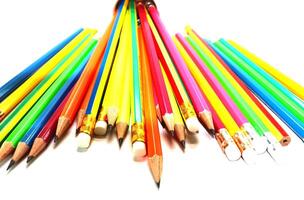 Pencils of different colors on table background photo