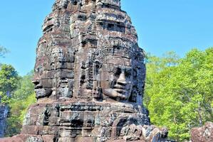 Bayon temple in Cambodia, faces of unknown deities photo