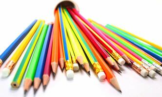 Pencils of different colors on table background photo