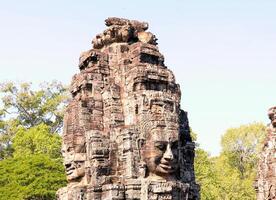 Bayon temple in Cambodia, faces of unknown deities photo