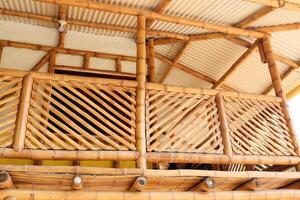 Bamboo house, natural wood Eco house, texture, art tree in the tropics photo