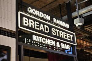 Bangkok, Thailand May 08, 2024 Bread Street Kitchen and Bar sign. It is the first restaurant of Gordon Ramsay that is located at Emsphere, Bangkok Thailand. photo