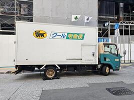 Fukuoka, Japan November 18, 2023 Yamato transport truck. is a famous and largest door-to-door delivery service companies in Japan, was founded in November 1919. photo