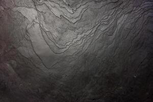 Black stone wall texture for background. photo