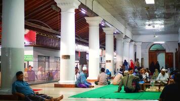 people resting in the Sunan Ampel mosque area in Surabaya. May 31, 2022 photo