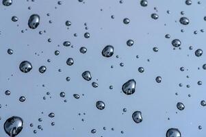 Water Drops on Car Windshield on Gloomy Day photo