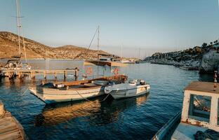 Sailboats in the Harbor among Beautiful Mountains photo