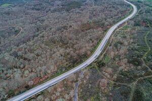 aerial drone view of a mountain road in winter photo