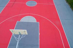 drone aerial view of a red and gray basketball court photo