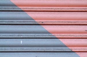 pink and gray painted metal shutter detail photo