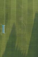 Aerial view of a grass soccer field goal photo