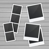 photo frames collection on wooden background vector