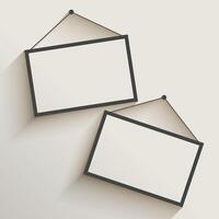 blank photo frame hanging on wall vector