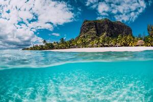 Tropical transparent ocean with Le Morne mountain and luxury beach in Mauritius. Split view. photo