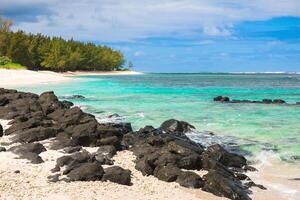 Tropical beach with rocks and transparent ocean in Mauritius photo
