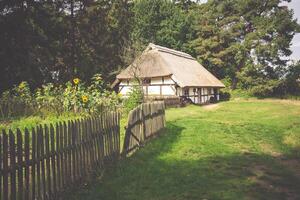 Traditional thatched house Kluki Poland photo