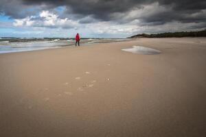 Women Walking along the beach. photo