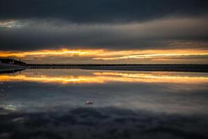 Sunset on the beach in Leba, Baltic Sea, Poland photo