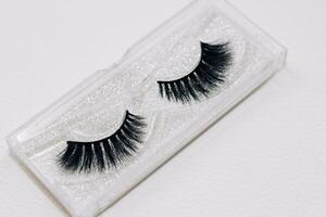 False decorative eyelashes on a white background. photo