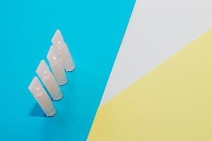 Probiotics medicine in vial on blue background. photo