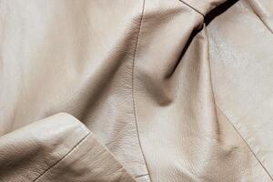 Brown leather jacket texture, genuine soft leather. photo