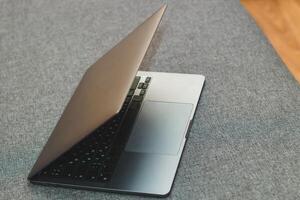 Laptop series flat metal on the table. photo