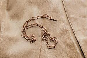 Decoration on the texture of a brown leather jacket, genuine soft leather photo