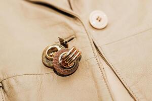 Decoration on the texture of a brown leather jacket, genuine soft leather photo
