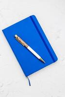 The pen lies in the notebook, the concept of study, time management. photo