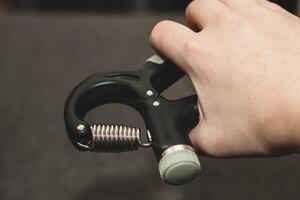 Wrist expander, black hand and finger massager. photo