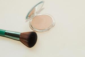 Green make-up bones on a light background with a highlighter. photo