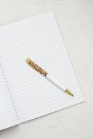 The pen lies in the notebook, the concept of study, time management. photo