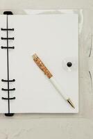 The pen lies in the notebook, the concept of study, time management. photo