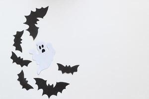 Paper bats on a purple background, Halloween concept photo