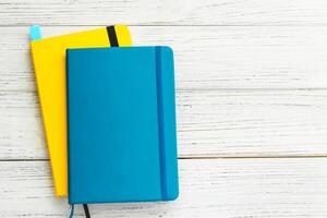 Notebook diary for planning in blue and yellow. photo