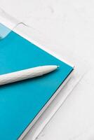 The pen lies in the notebook, the concept of study, time management. photo