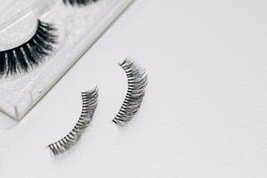 False decorative eyelashes on a white background. photo