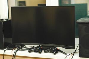 Game big computer screen with game joysticks, gamer's place. photo