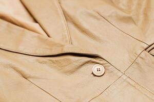 Brown leather jacket texture, genuine soft leather. photo