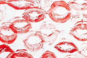 Imprint of red lips on white paper, kiss background photo