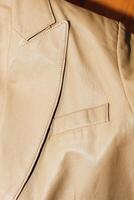 Brown leather jacket texture, genuine soft leather. photo