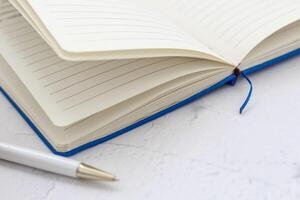The pen lies in the notebook, the concept of study, time management. photo